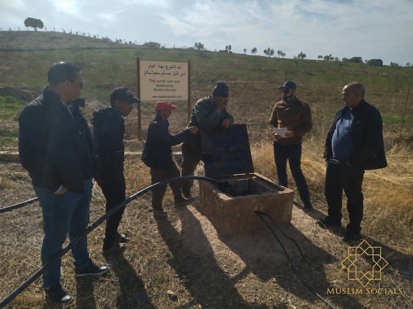 Muslim Socials donated water well with dedication sign