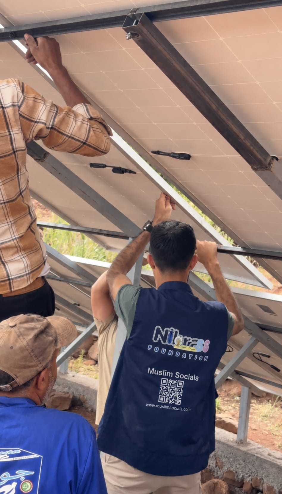 Muslim Socials volunteers installing solar panels for a water pump